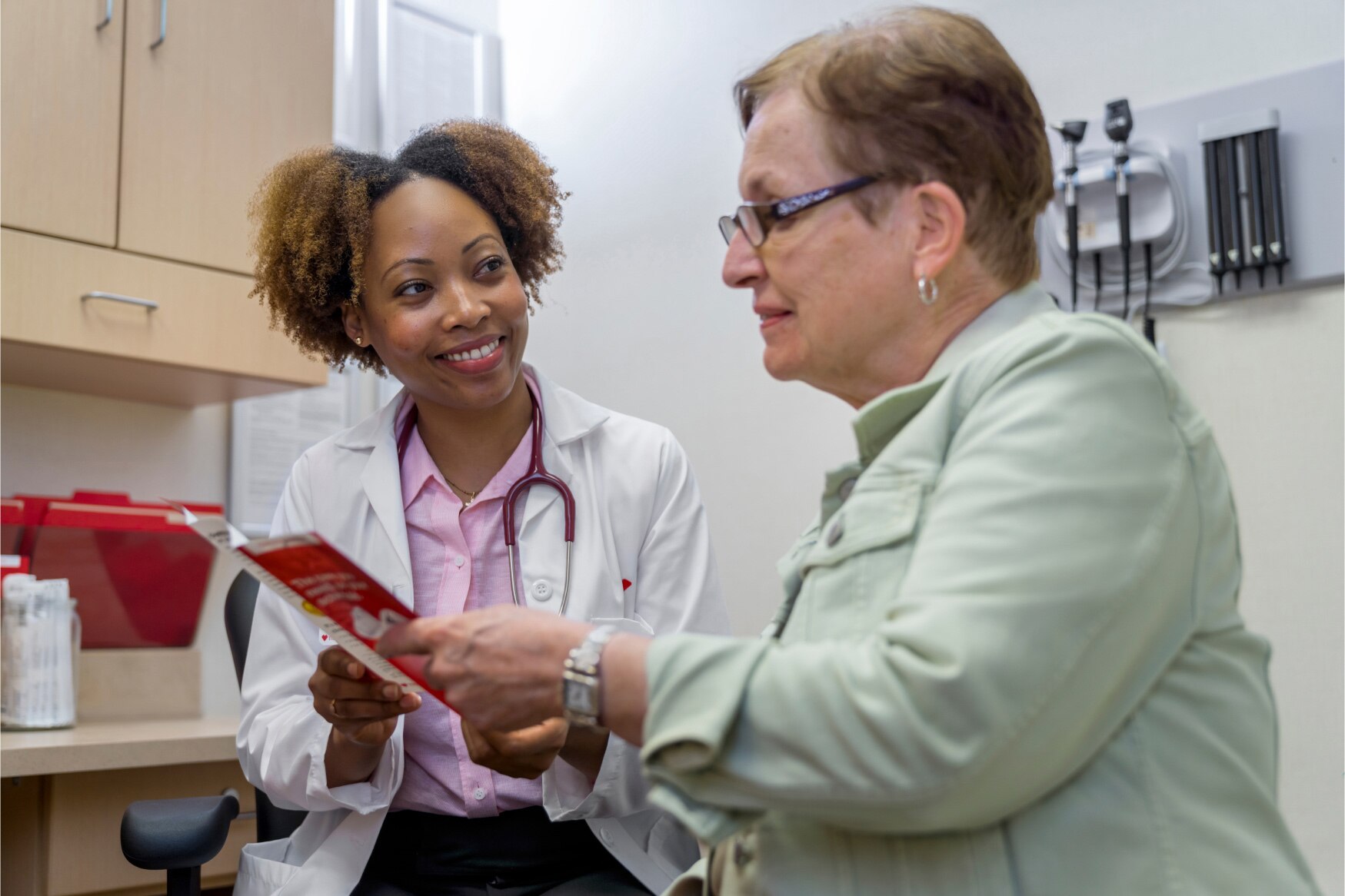 A MinuteClinic provider is helping educate her patient about diabetes.