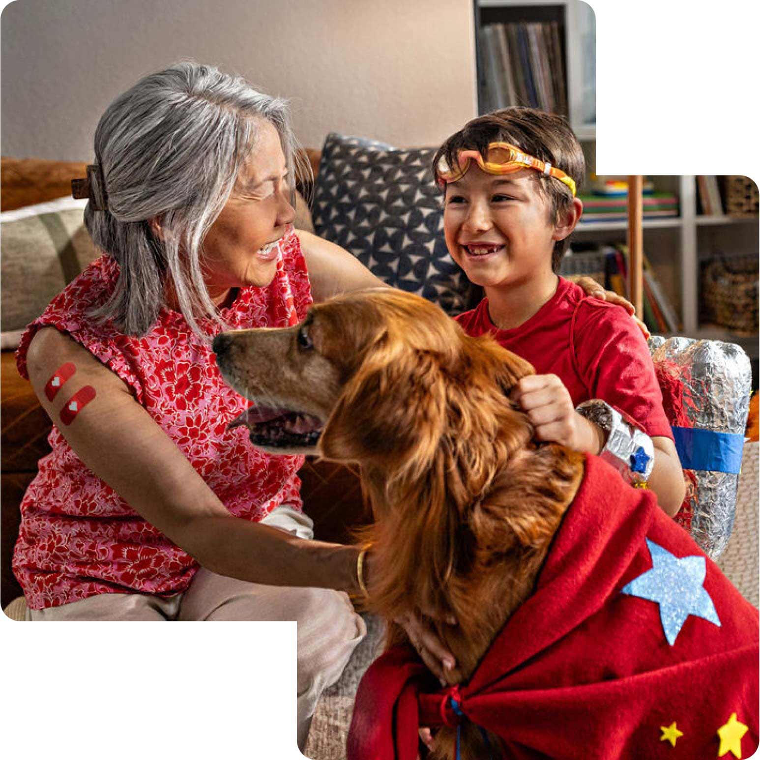 A grandparent plays with their grandchild and the family dog after getting vaccinated.