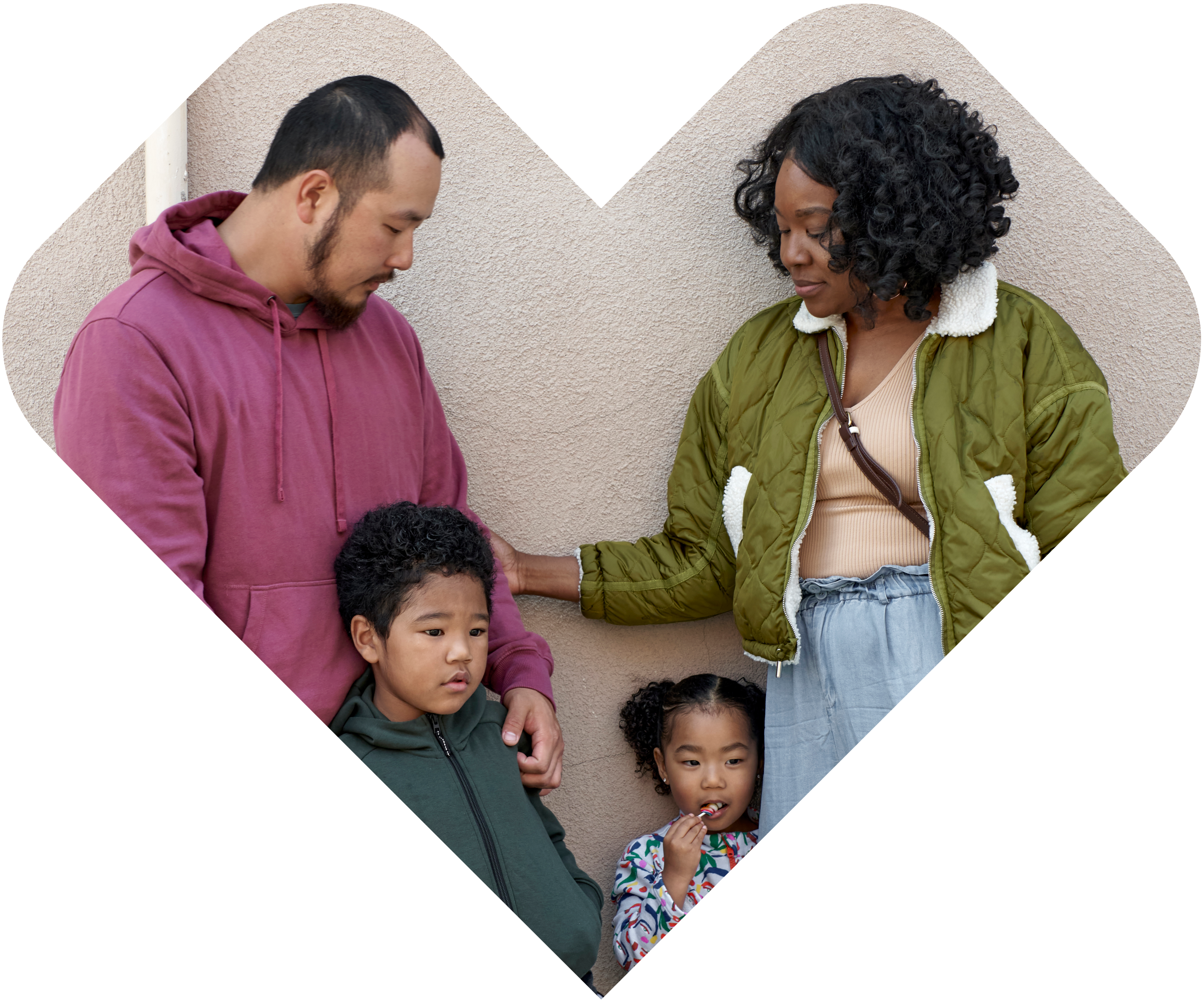 Family standing together framed in a CVS heart