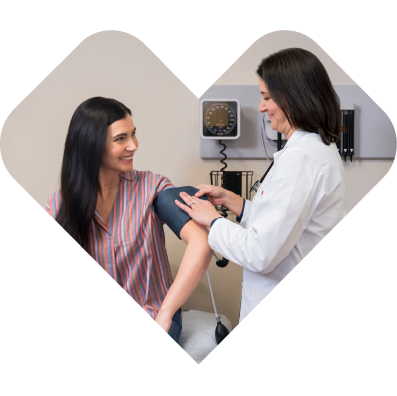 A teacher calls on a student who has their hand raised.