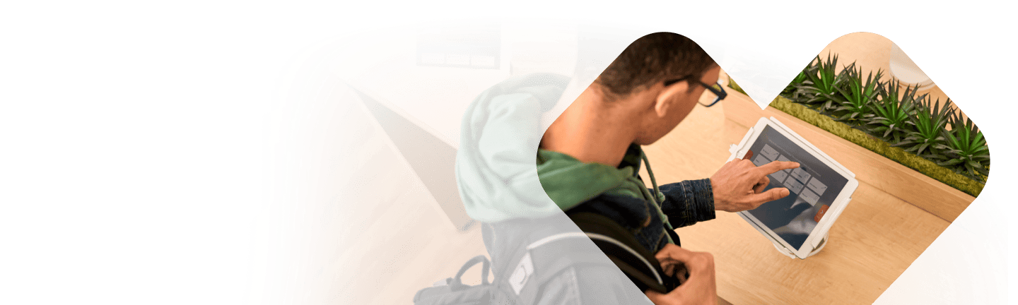 A patient using a kiosk to check in for an in-person MinuteClinic® appointment.